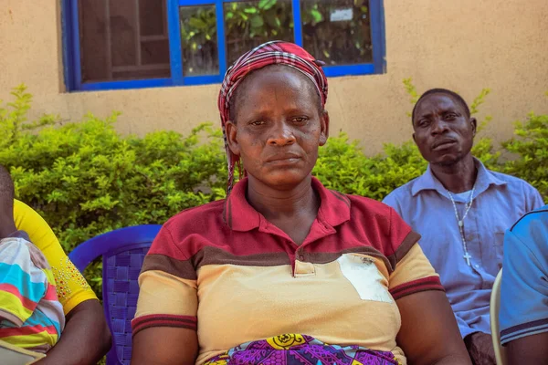 stock image Edo State, Nigeria - August 10, 2021: Africans sitting, queuing and Waiting for Free Medical Care and Attention in a Rural Community