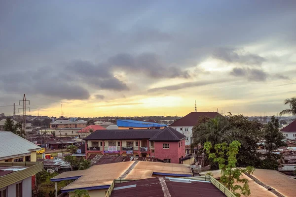 stock image Jos East, Plateau State, Nigeria - September 12, 2021: dramatic view of African village at sunset 