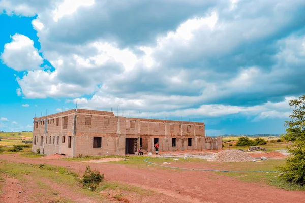 stock image Opialu, Benue State, Nigeria - March 6, 2021: Typical Housing Structure in an African Village on a Warm Afternoon - Mud House