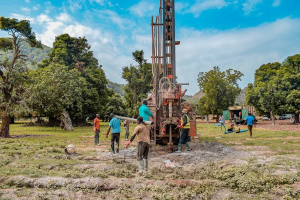 Stock image Jos East, Plateau State - May 12, 2021: Water Drilling Process in an African Community with Mechanized Equipment. Drilling Machine Rural Water Project.