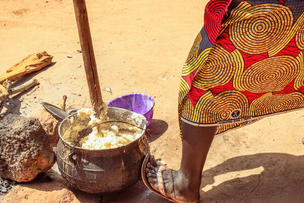 Opialu, Benue State, Nigeria - March 6, 2021: Hardworking African Woman engaged in her Activity in her Community