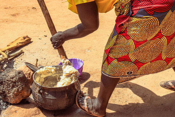 Opialu, Benue State, Nigeria - March 6, 2021: Hardworking African Woman engaged in her Activity in her Community
