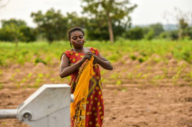 Talata, Plateau State - April 2, 2023: Woman Fetching Water for Domestic Use. clipart