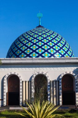 Exploring Majestic Architecture: Domed Building with Blue Tiles Meets Clear Sky in Harmony with Decorative Facade and Intricate Design Elements clipart