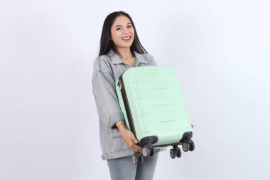 Woman Holds Luggage, Ready for Vacation Travel Adventure: Exploring New Destinations clipart