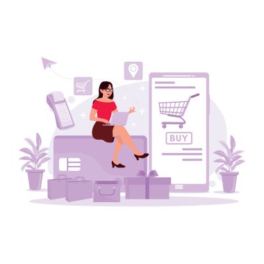 Genç bir kız oturuyor ve dizüstü bilgisayar kullanıyor, banka kartı kullanarak internetten alışveriş yapıyor. Modern vektör düz resimleme eğilimi.