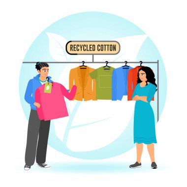 Genç bir adam, sürdürülebilir moda mağazasında çevre dostu kavramını somutlaştırmak için elbise rafındaki geri dönüşümlü pamuktan yapılmış çevre dostu giysiler alıyor. Atık Azaltma Konsepti.