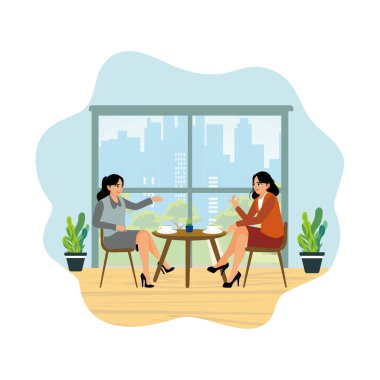 İki genç kadın bir kafede boş vakitlerinin tadını çıkarıyorlar. Birlikte sohbet edip kahve içiyorlar..