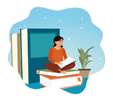 Bir kitabın üzerinde otururken kitap okuyan genç bir kadın. Elinde kitap tutan genç bir kadın..