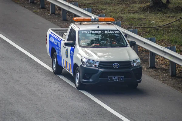 stock image a car of security officers and toll road services in Indonesia that was driving slowly in the side lane, Indonesia, 23 June 2023.