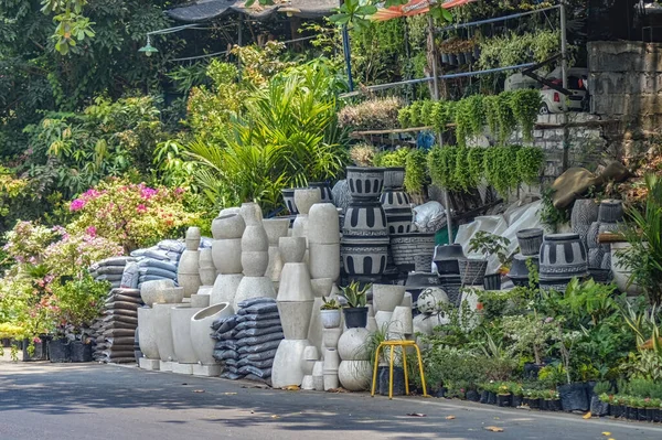 a stall selling ornamental plant supplies that looks like various kinds of flower pots, Indonesia, 2 November 2023.
