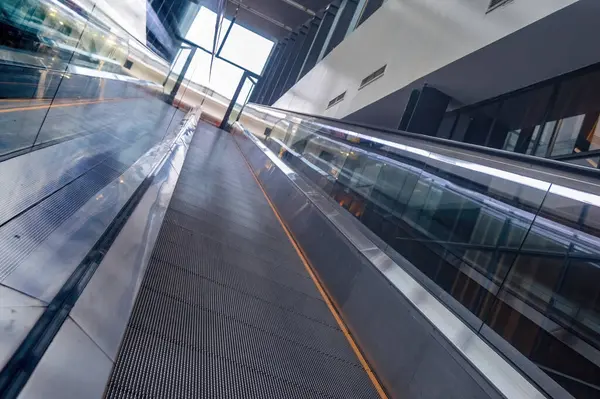 an upward escalator that looks futuristic