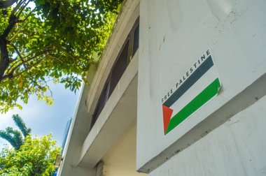 Free Palestine stickers on the walls , Indonesia, 2 March 2024 clipart