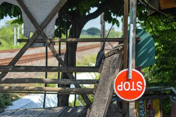 stock image a stop sign that hangs on a railroad crossing