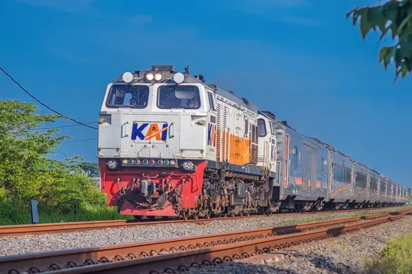 stock image a series of Indonesian executive class trains speeding on double tracks, Indonesia, 4 May 2024.