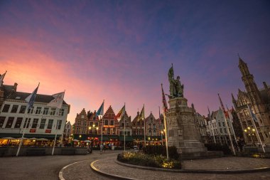 Sunset View of Jan Breydel Monument and the Historic Buildings of Market Square (Grote Markt) - Bruges, Belgium clipart