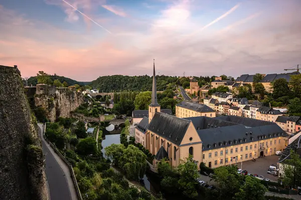 stock image A Magical Sunset over Neumunster Abbey and the Grund from Chemin de la Corniche - Luxembourg City