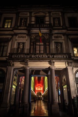 Galeries Royales Saint-Hubert Entrance Illuminated in Belgian Flag Colors at Night - Brussels, Belgium clipart