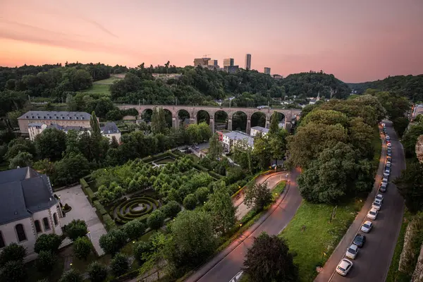 stock image View from the Bock Outcrop on Pont du Chateau to the Garden of Pfaffenthal Hospice and Viaduct Ferroviaire at Dusk - Luxembourg City