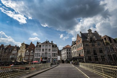 Classic Gabled Houses on Korenlei from Grasbrug under Dramatic Clouds - Ghent, Belgium clipart