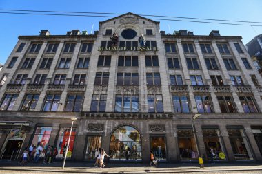 Madame Tussauds Building in Dam Square on a Sunny Day - Amsterdam, Netherlands clipart