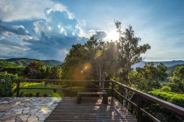 Wooden Deck amid Rolling Hills under the Sunlight in the Countryside of Brazil clipart