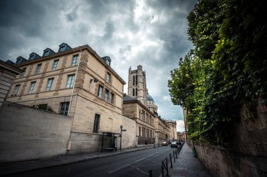 Historic Street View on Rue Clovis under Dramatic Skies - Paris, France clipart