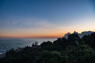 People Gathering on Pedra do Arpoador at Dusk - Rio de Janeiro, Brazil