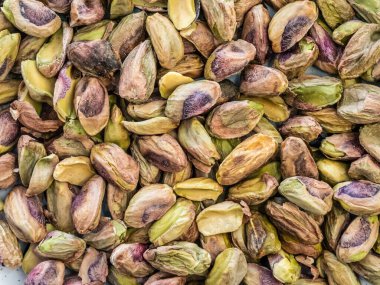 Kabuğu soyulmuş fıstık yığını, yakın çekim makro desen detayı.