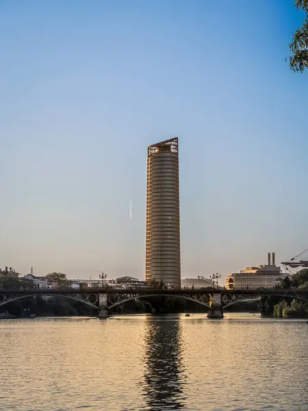 stock image View of Seville Tower (Torre Sevilla) of Seville, Andalusia, Spain over river Guadalquivir at sunset, during summer