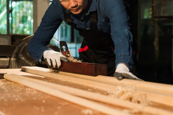 Young Asian Craftsman Working Diligently His Workshop Planing Wood Using — Stock Photo, Image