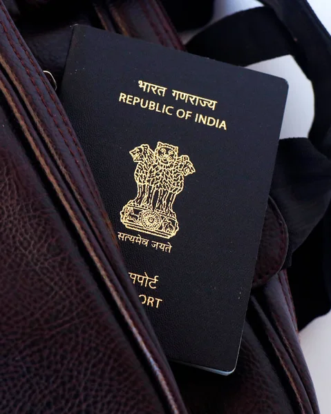 indian national blue passport on a traveling bag in close up