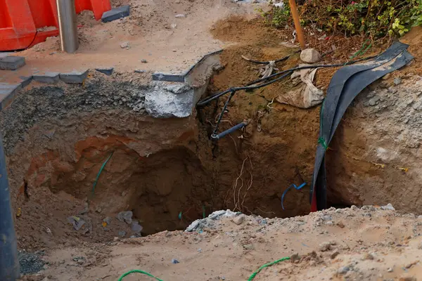 deep excavation near the foot path due to underground cable work