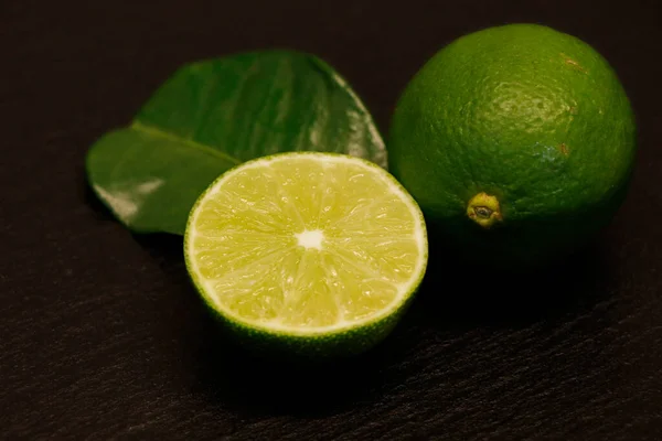 Half Whole Lime Isolated Black Background — Stock Photo, Image