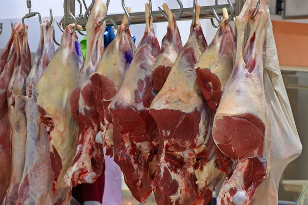 stock image butcher shop with hanged fresh red meats