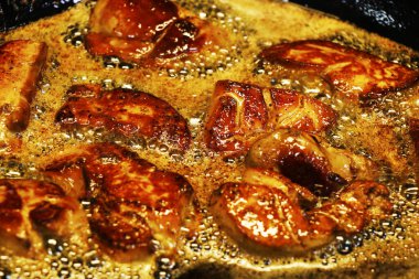 duck or goose foie gras cooking in a hot pan, oily and greasy delicacy food clipart