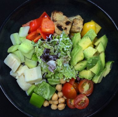 cobb salad in a black plate clipart