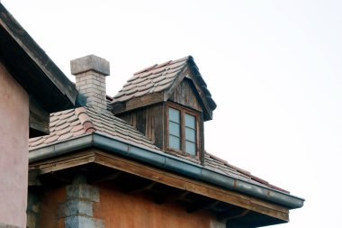 classic european roof and brick work with chimney clipart