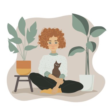 Kahverengi kıvırcık saçlı, pembe kazaklı çizgi film kızı kedisi tencerede çiçeklerle yerde oturuyor.