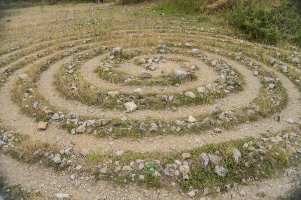 stock image Circular labyrinths on the ground of grass and stones near the Konepruske cave. Czech. High quality photo