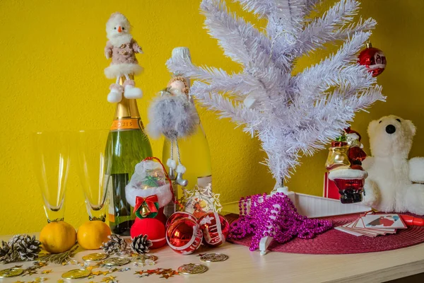 new year background with toy, Champagne and tangerines. Christmas Celebration. High quality photo