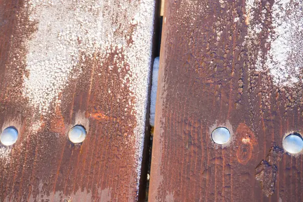 Large horizontal photo. wooden boards. frost on an old wooden staircase. nails in the boards close-up. macro. cold winter. frosty wood. silver glare on a wooden canvas. Horizontal Image Copy Space.