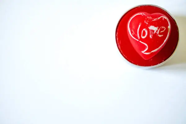 Red heart candle natural wax love getaway on white background, beautiful red heart shaped candles Copy space. High quality photo