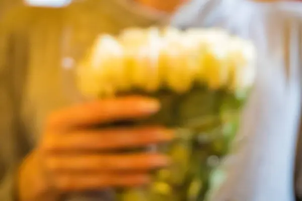 backraumd Beautiful young woman with bouquet of white roses . Valentines Day celebration. Mothers Day. Teachers Day. March 8. bouquet close up. High quality photo