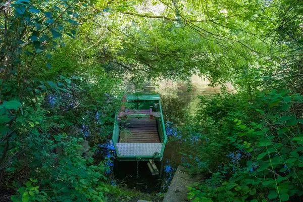 Beautiful views of the river Berounka a Wooden boats in the spring season. Czech, Near Karlstejn. High quality photo