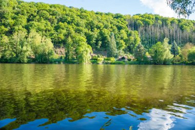 Beautiful views near the Berunka River in spring, forest and mountains. Near Karlstejn. Czech. High quality photo