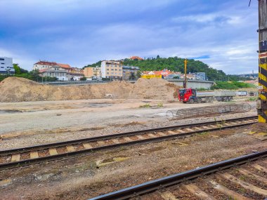 Prague- Czech- 16 July 2024: Construction of a new railway station in Smichov, Prague. Train and railway station with railroad tracks, platform. High quality photo clipart