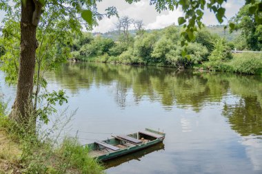 Beautiful views of the river Berounka a Wooden boats in the spring season. Czech, Near Karlstejn. High quality photo