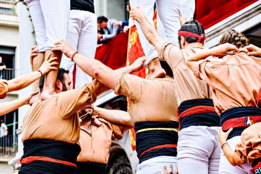 Igualada, Barcelona; August 25, 2024: Performance of the human tower by the Xiquets de Reus group at the main festival of the city clipart