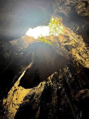 Exploring the Enigmatic Phnom Kbal Romeas Cave near Kampot, Cambodia. Venture into the mystical Phnom Kbal Romeas Cave, a hidden gem near Kampot, Cambodia. This captivating image captures the caves. clipart